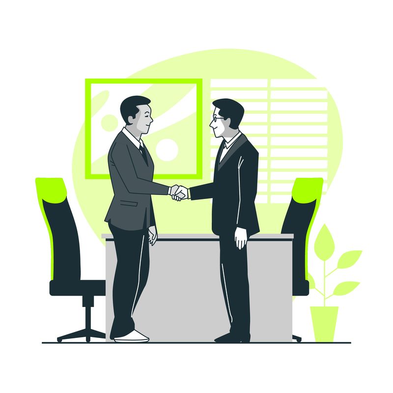 Businessmen in an office shaking hands, representing collaboration and mutual understanding in a corporate environment.
